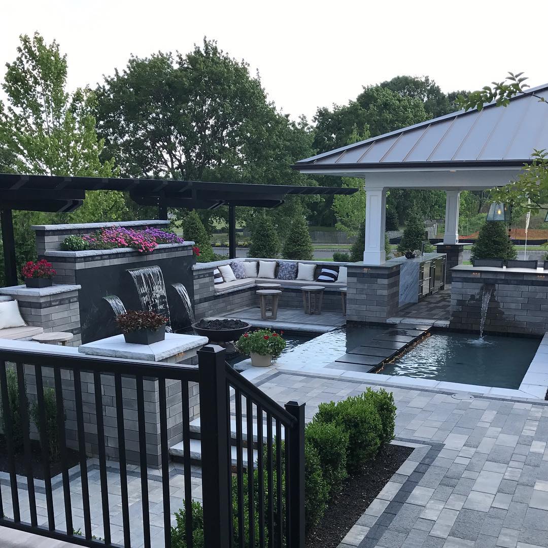 Outdoor kitchen attached to a waterfall. Photo by Instagram user @letsstayhome