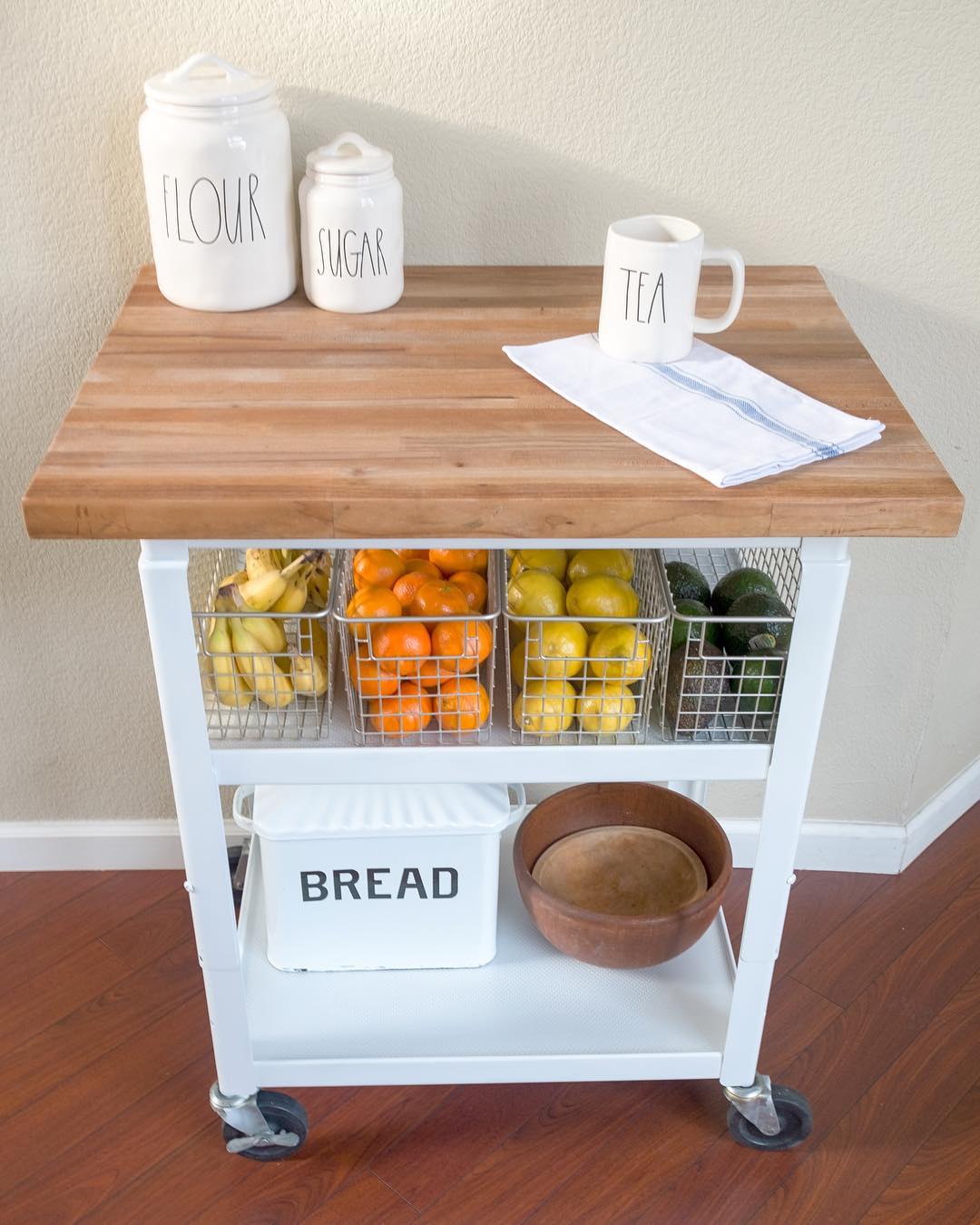 Small rolling kitchen cart for small apartment use. Photo by Instagram user @bloomsandboxwood