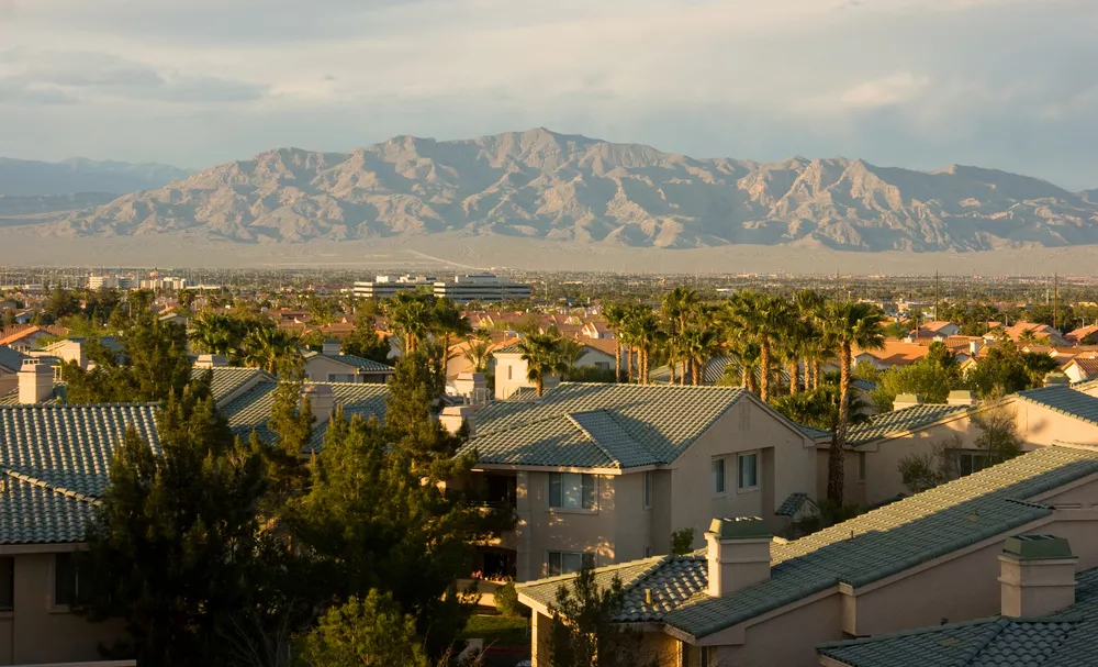 aerial shot of a neighborhood in Las Vegas with mountains in the distance