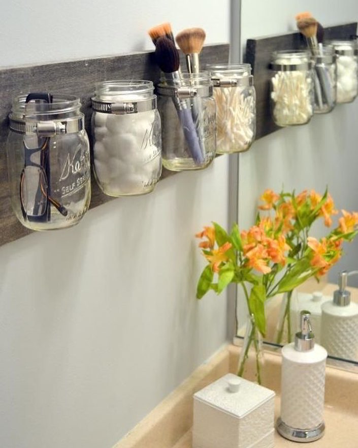 Mason Jars Hanging on Bathroom Wall Holding Toiletries. Photo by Instagram user @household_plastic