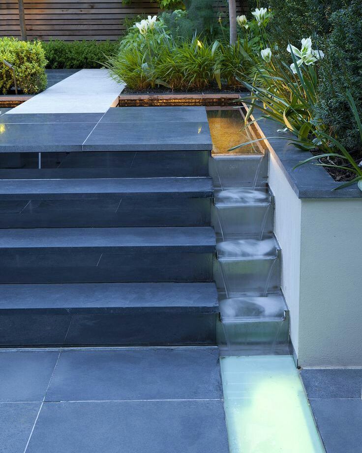 Waterfall going down a staircase in backyard. Photo by Instagram user @californiawaterscapes