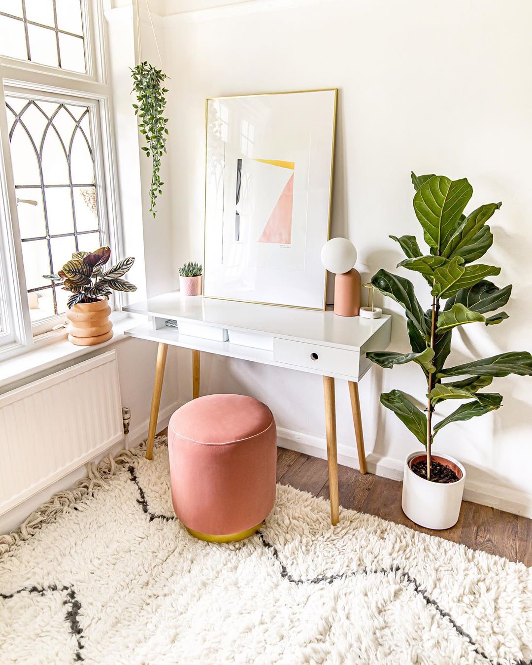 modern home office with stool seat and plants placed around photo by Instagram user @homewithkelsey