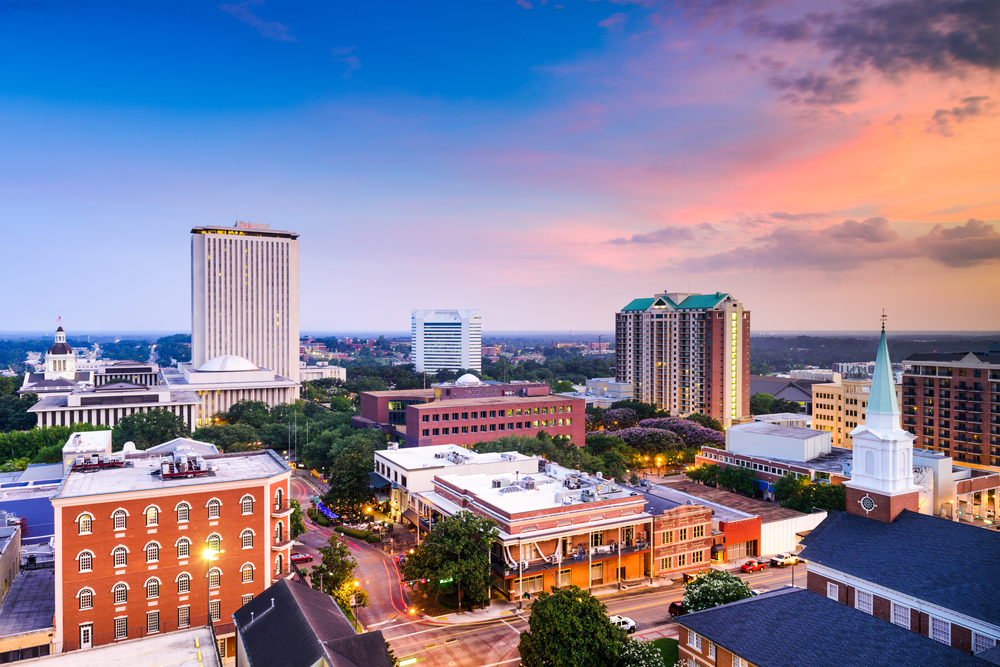 aerial shot of downtown Tallahassee overlooking tall buildings at sunset