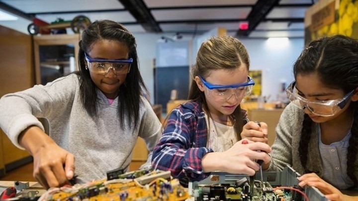 Three Young Girls Working on Tech Together at the Challenger Learning Center. Photo by Instagram user @challengertlh