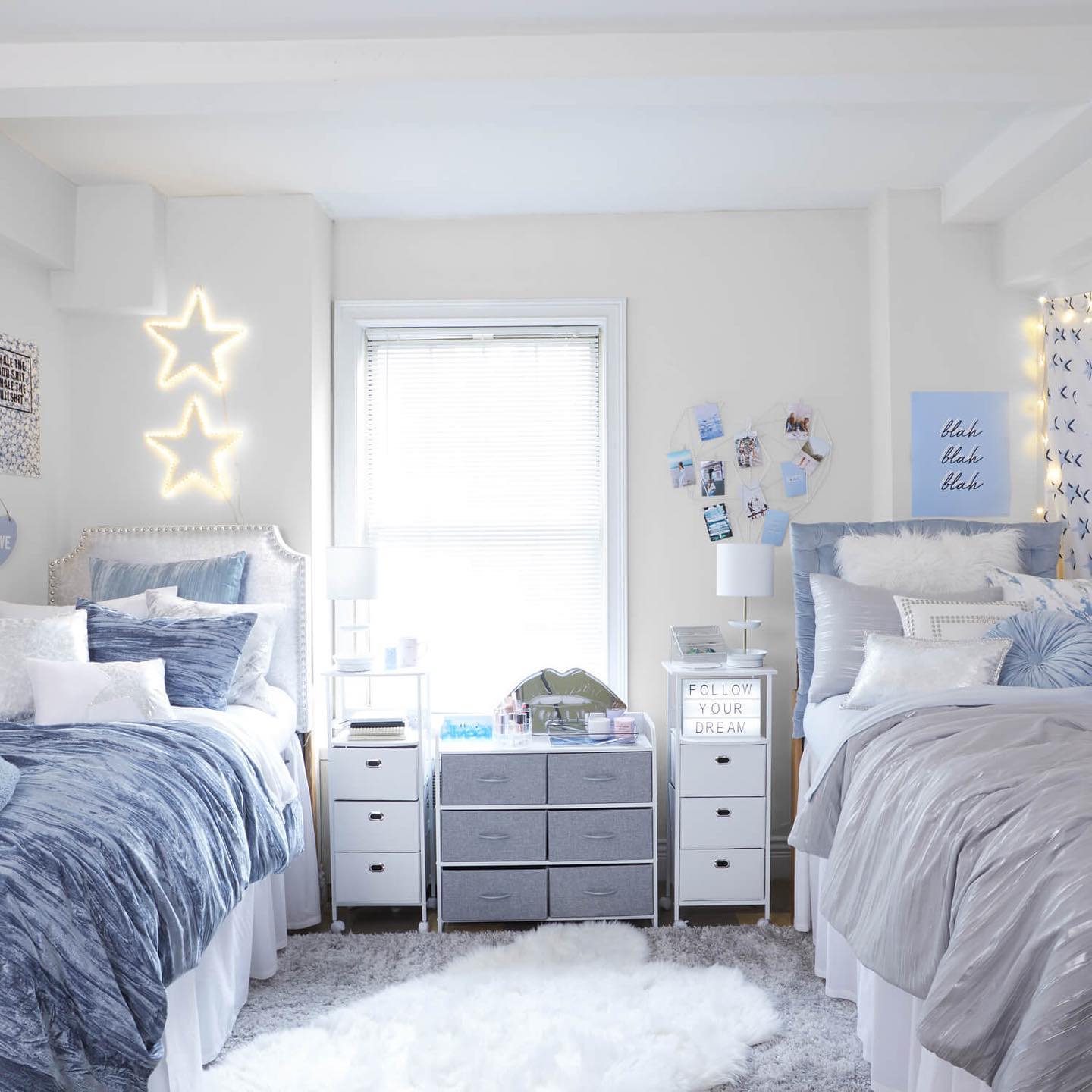 Dorm room with two twin beds with grey and blue decor Photo vis @dormify