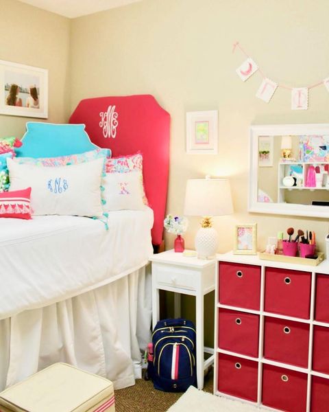 White and pink dorm decor with cube storage Photo via @letsgetpreppy_