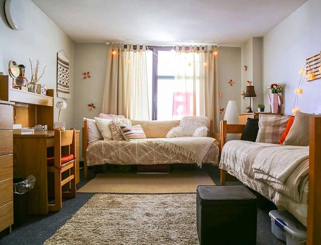 dorm room with neutral colors and sunlight photo via @rutgersreslife