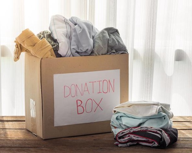 Donation Box Filled with Old Clothes. Photo by Instagram user @plant64apts