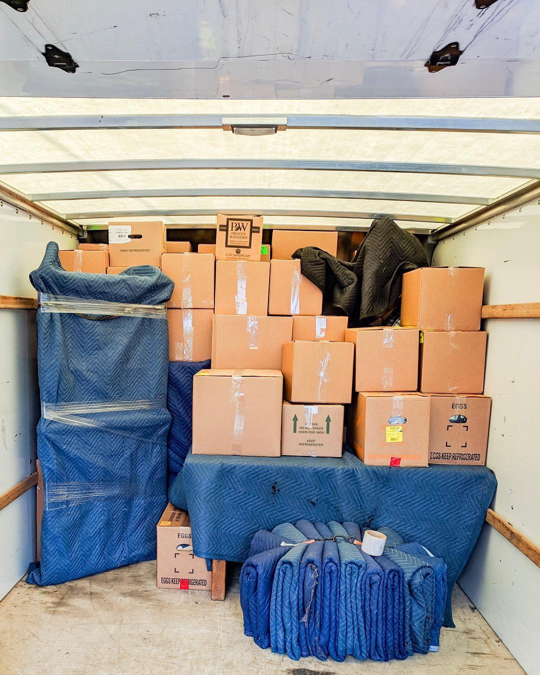 Boxes Neatly Stacked in Back of Moving Truck. Photo by Instagram user @lytleproperty