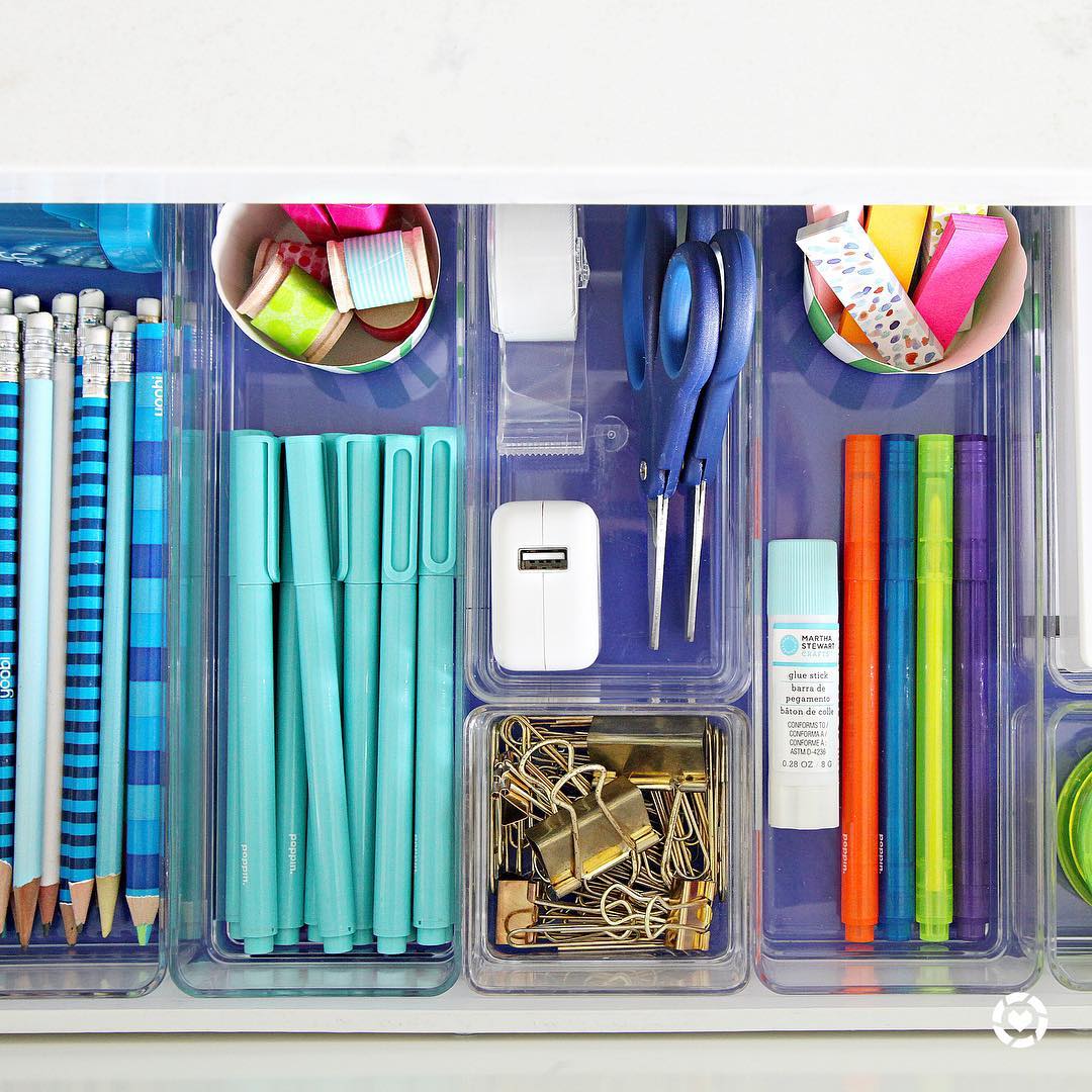 School supplies organized in clear plastic containers for desk. Photo by Instagram user @iheartorganizing