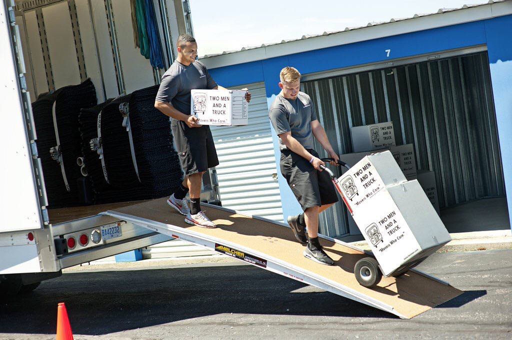 Professional Movers Moving Heavy Items Down a Ramp. Photo by Instagram user @twomenandatruck