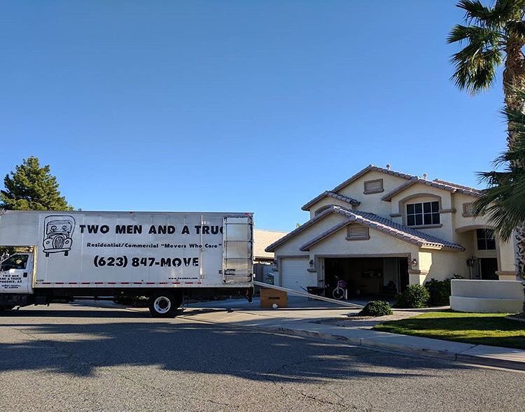 Professional Moving Truck in Front of a House. Photo by Instagram user @twomenandatruck