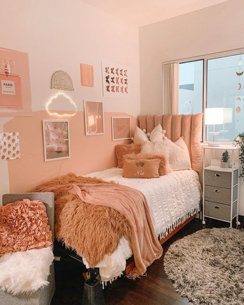 pink dorm room with a rolling cart Photo via @lemontine.design