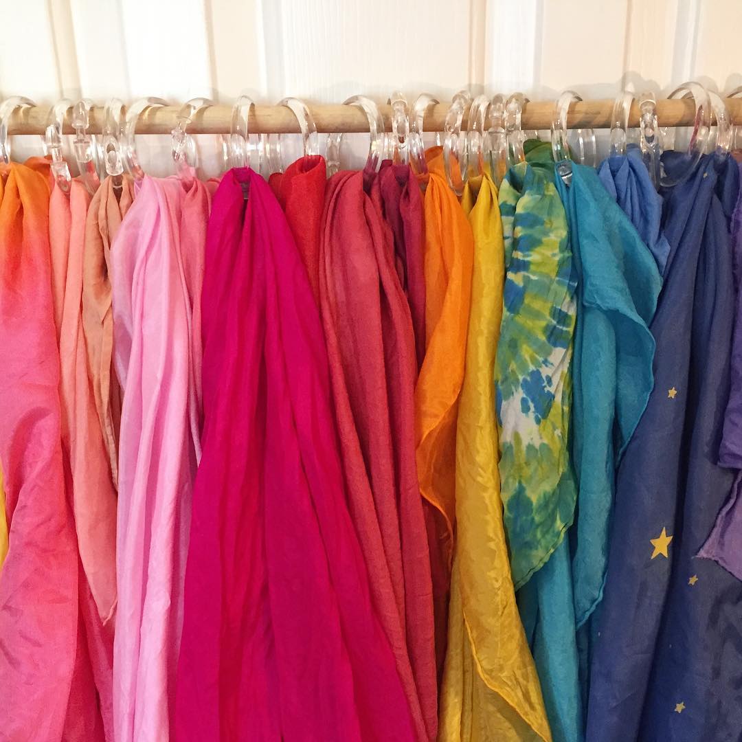 Colorful scarves hanging with shower curtain rings. Photo by Instagram user @pepperandpine