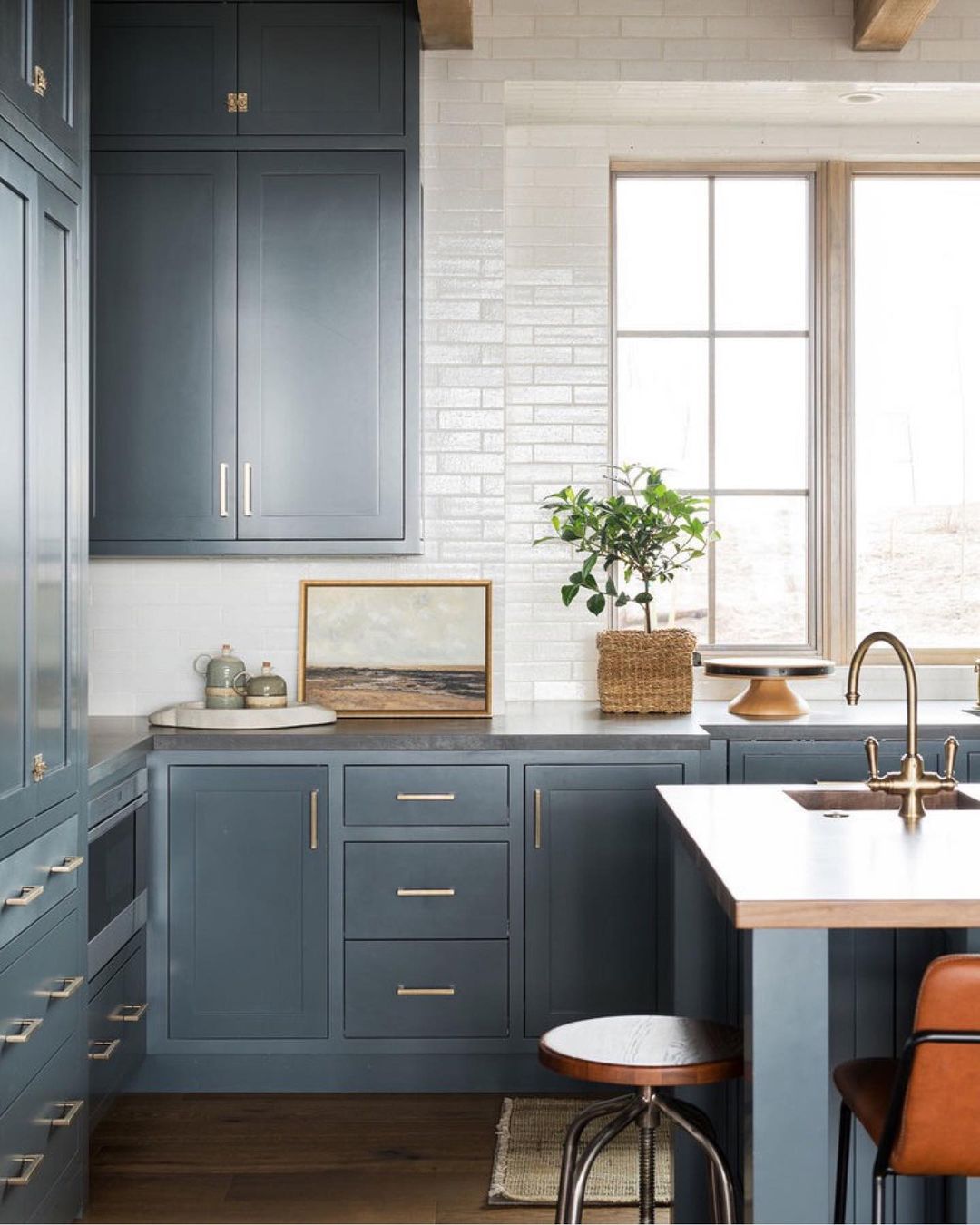 dark blue kitchen with white tile. Photo via @studiomcgee