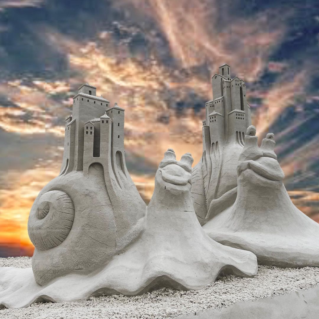 Snapshot of large, cartoon-like snails as a sand sculpture from the Siesta Key Crystal Classic International Sand Sculpting Festival. Photo by Instagram user @puremaxim.