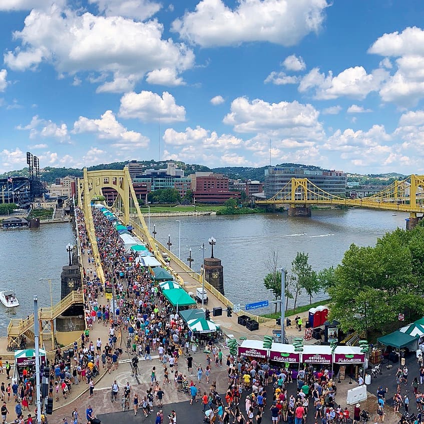 People on bridge celebrating local Pittsburgh Festival. Photo by Instagram user @downtownpitt