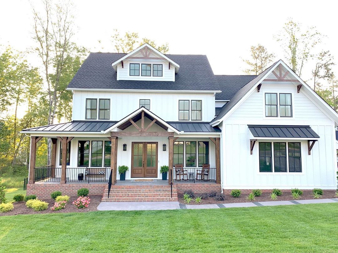 Farmhouse-style home with dormer in attic. Photo by Instagram user @buildingcolwynbay