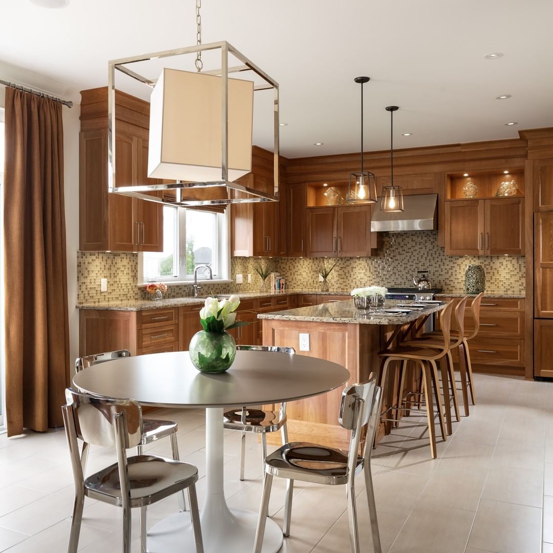 Kitchen with island and eat-in dining. Photo by Instagram user @tamarackhomes