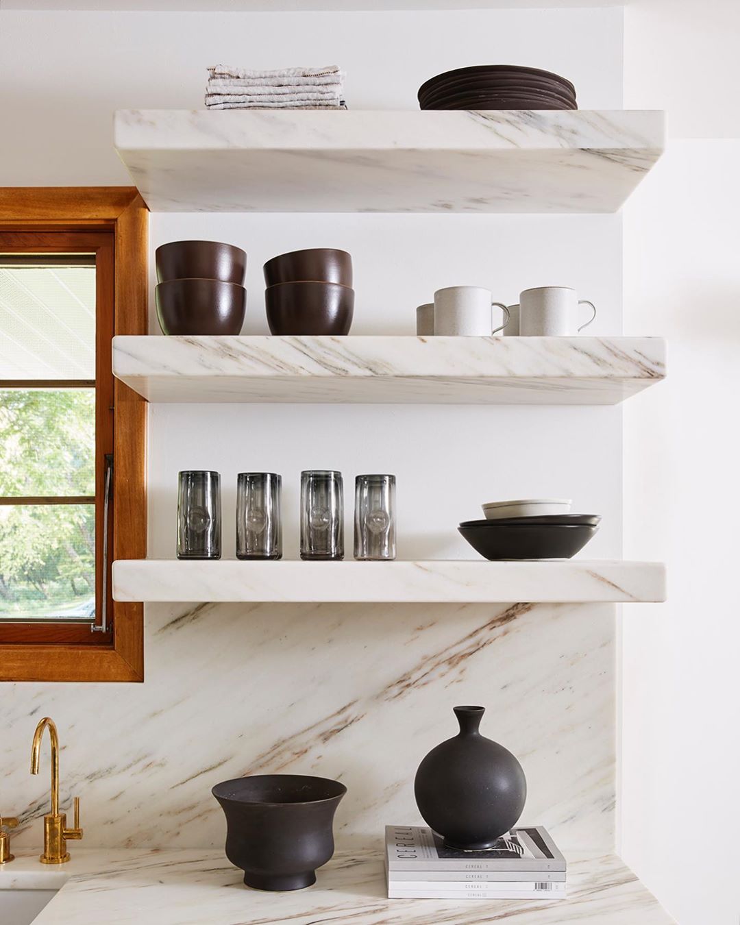 Open shelving in contemporary kitchen. Photo by Instagram user @jkath_designbuild