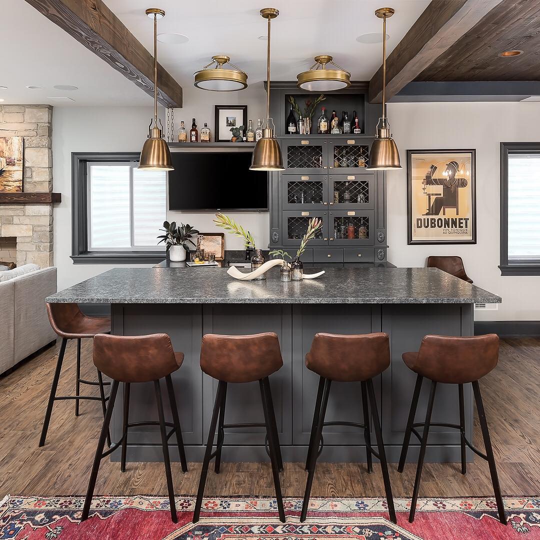 basement bar with nice overhead lighting and large island photo by Instagram user @pictureperfecthouse
