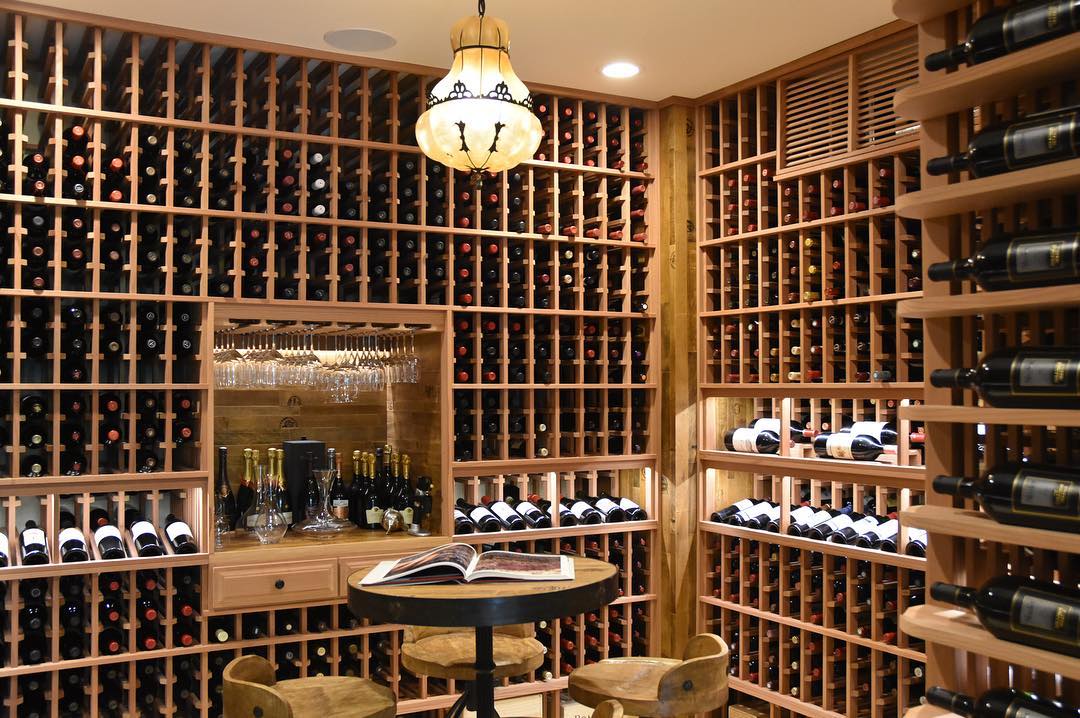 huge basement wine cellar with hundreds of bottles throughout photo by Instagram user @vintage_wine_cellars