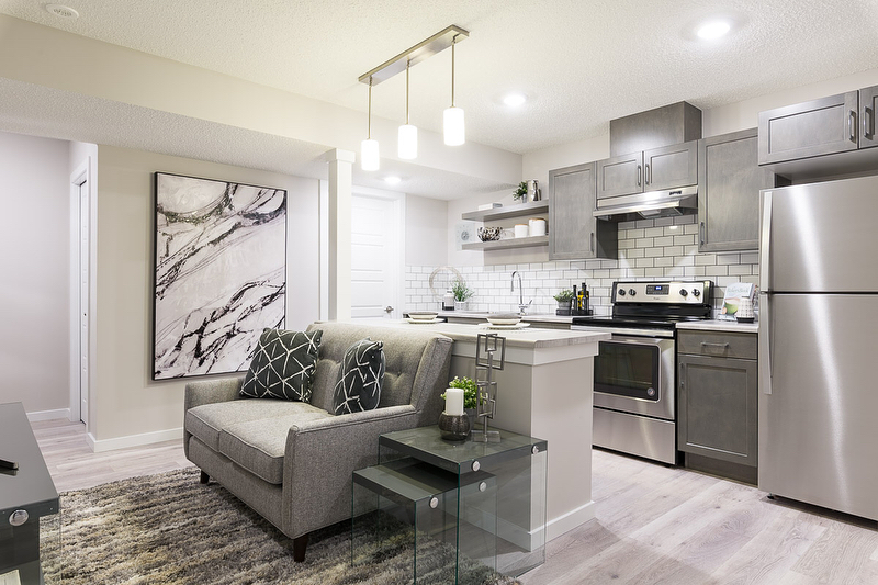 basement space with finished kitchen and apartment space photo by Instagram user @landmarkhomesyeg