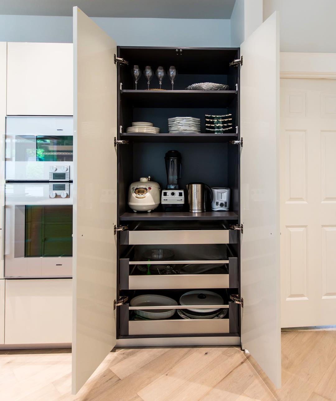 Tall kitchen cabinet with drawers. Photo by Instagram user @pednipdx
