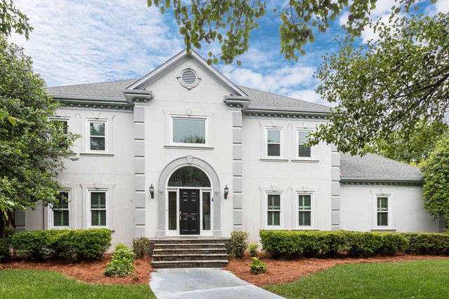 Classic white home with gray brick in Providence Country Club. Photo by Instagram user @deborahrussorealtorcharlotte