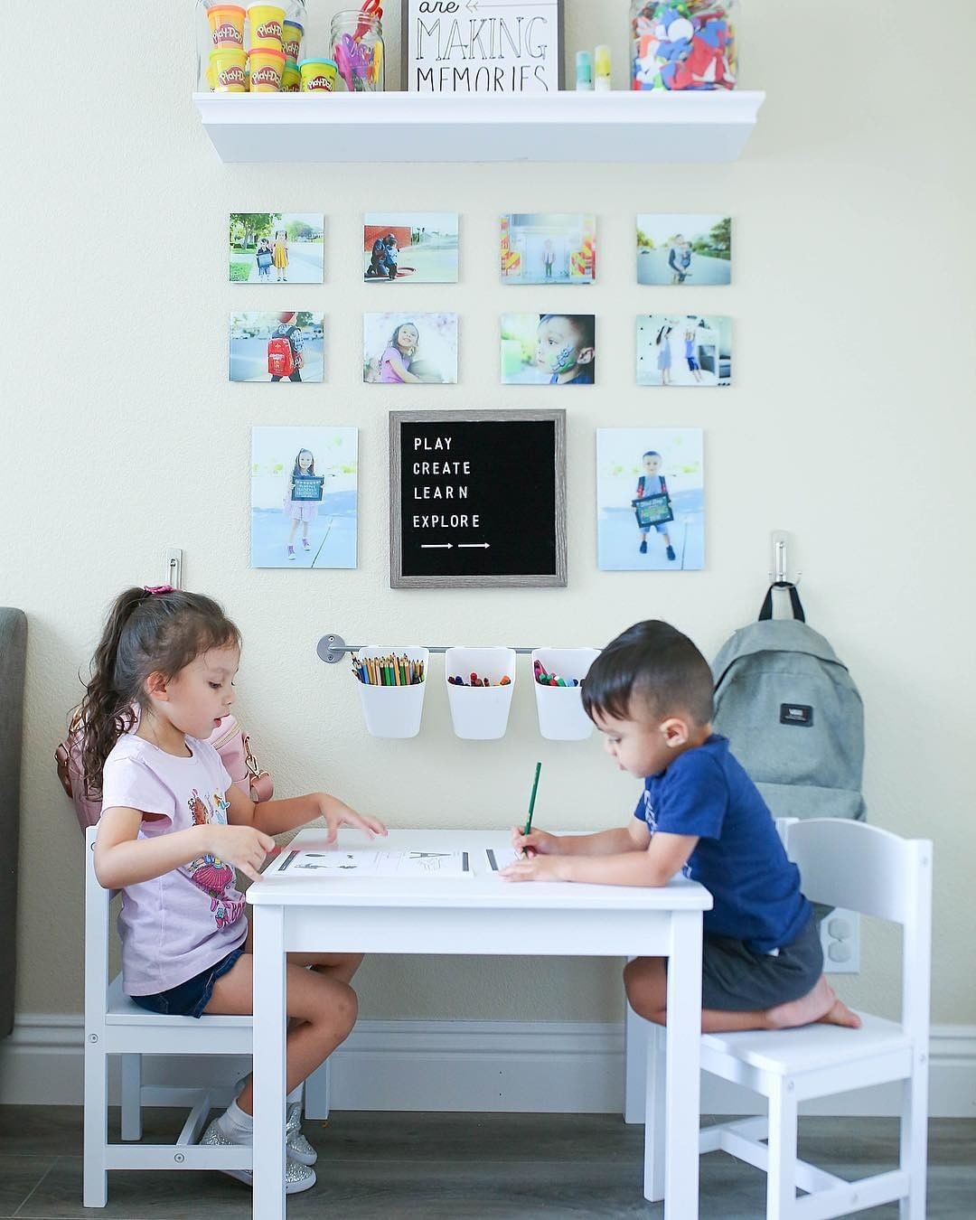 Kids at coloring table in living room.