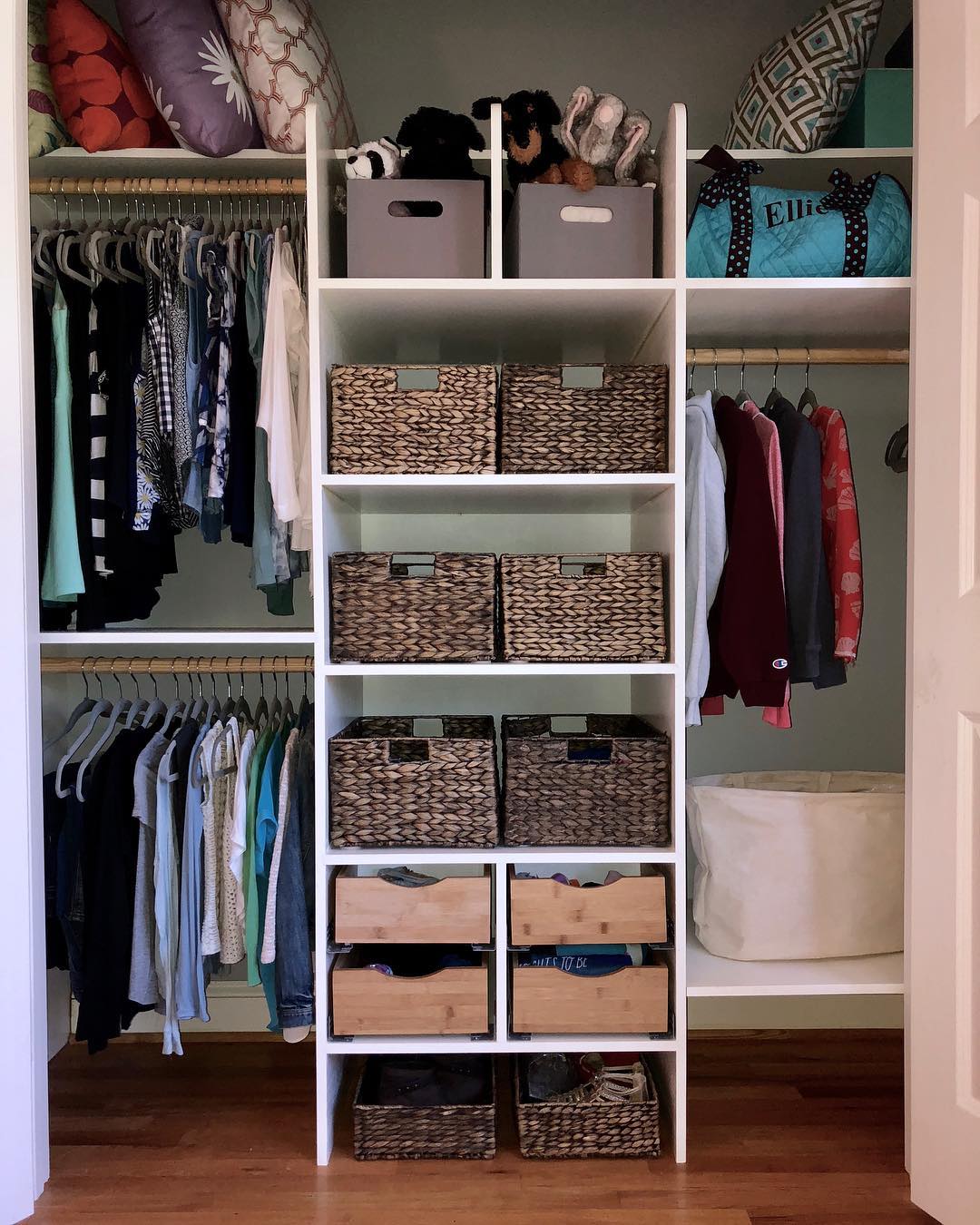 Closet with hanging shelves, storage boxes, and other storage.