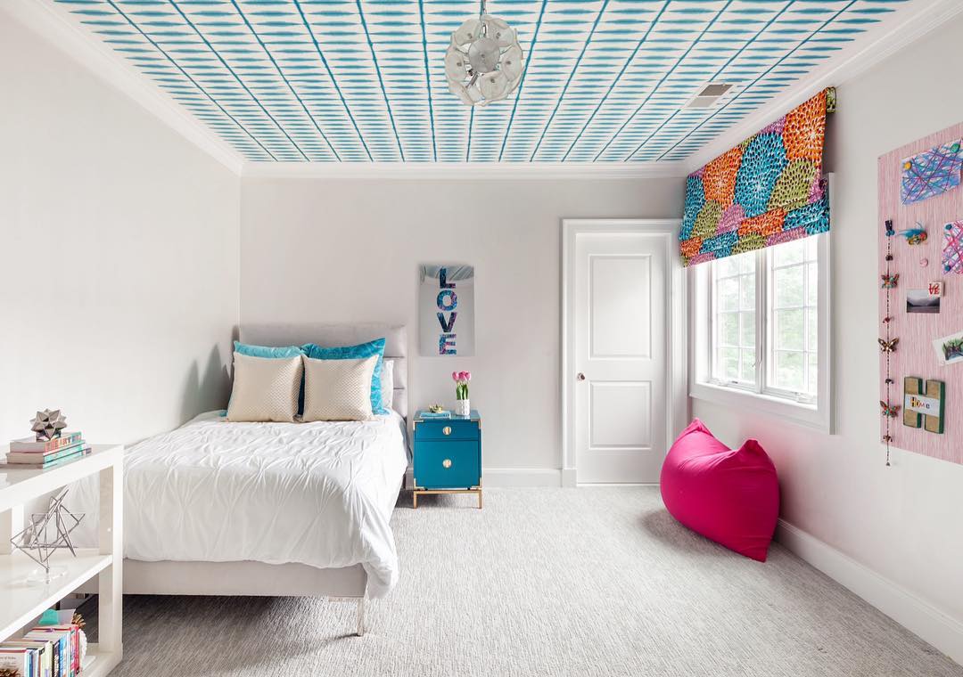 Teen bedroom with patterned ceiling.