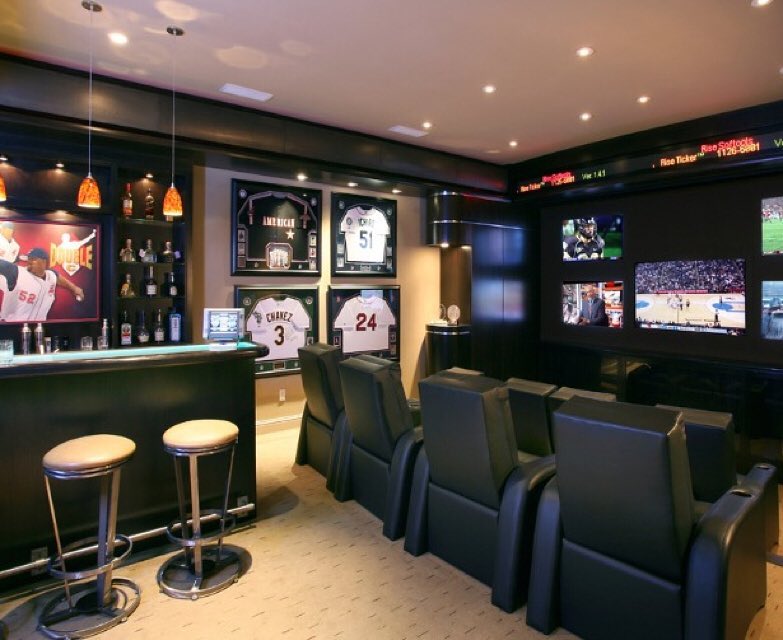 Basement Decorated with Sports Memorabilia. Photo by Instagram user @delta13rack