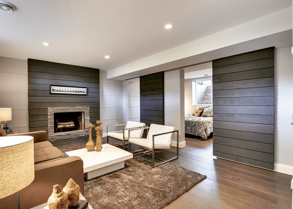 Basement Bedroom Separated by Sliding Doors. Photo by Instagram user @azlewisdesigns