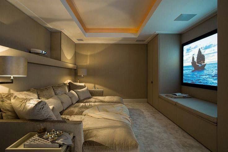 Basement Movie Room with Large Couch and Projector Screen Wall. Photo by Instagram user @improvenet