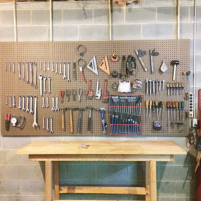 Basement Workshop Space with Pegboard to Hold Tools on the Wall. Photo by Instagram user @thejenniferburnham