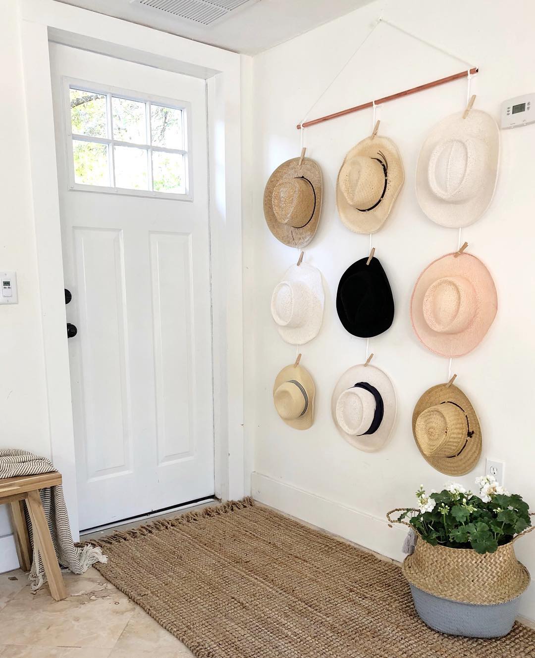 Hats hung on wall for display and storage. Photo by Instagram user @onceupona1912