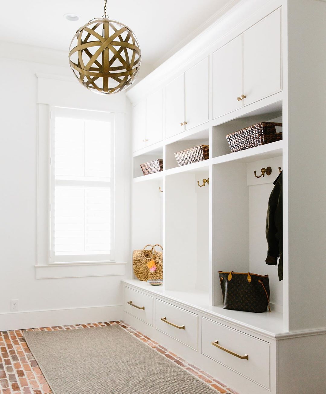 Custom cubbies in mudroom. Photo by Instagram user @langthomasinteriors