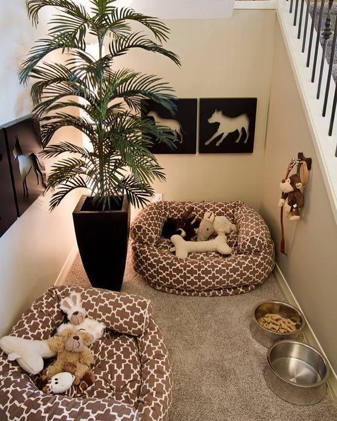 Dog Beds, Bowls, and Leashes in Nook by Stairs. Photo by Instagram user @trending_decor