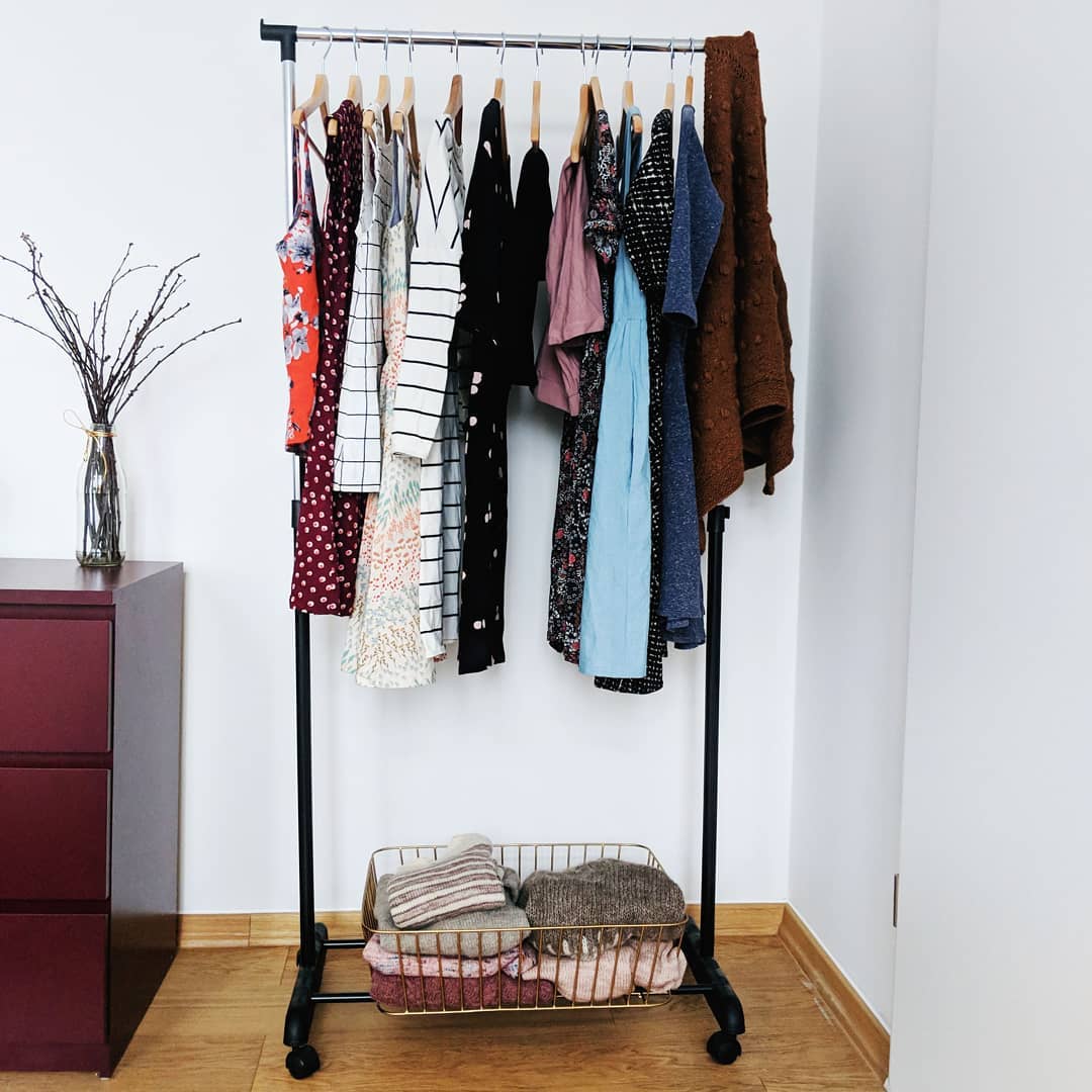 Capsule wardrobe on hanging rack. Photo by Instagram user @sopranoknits