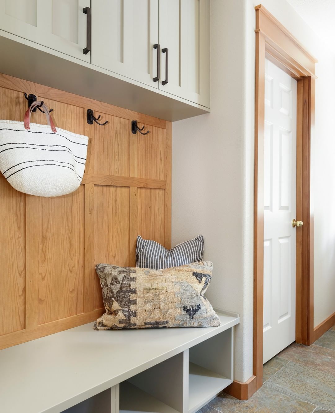 Mudroom with hooks for storage. Photo by Instagram user @amypearsondesign