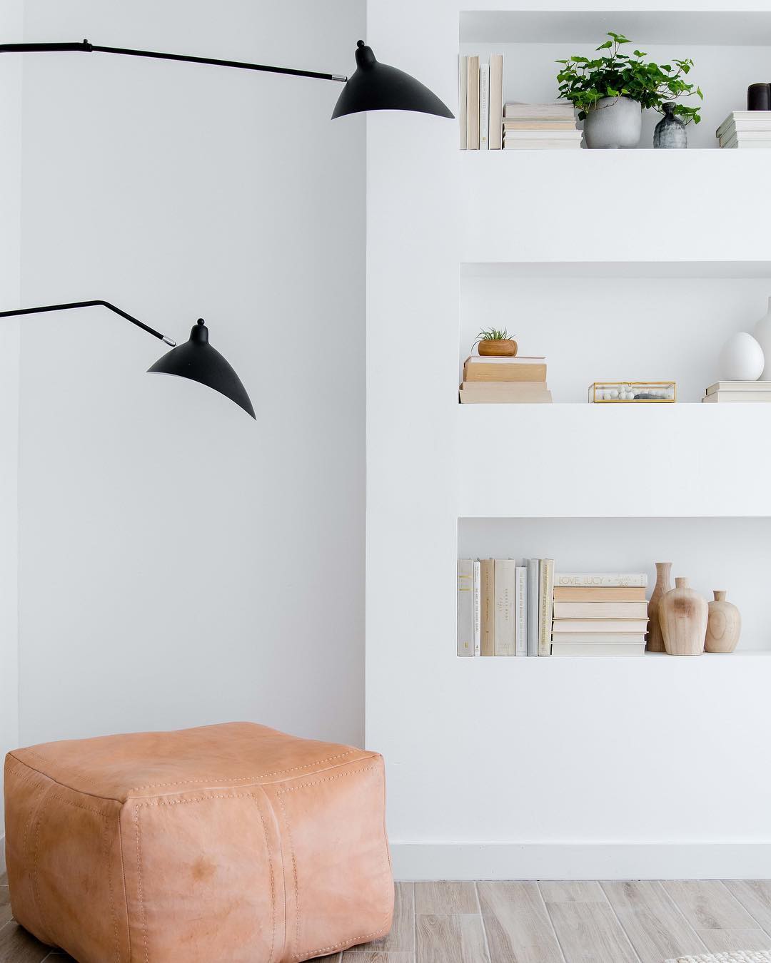 Recessed shelves in living room. Photo by Instagram user @thehabitatcollective