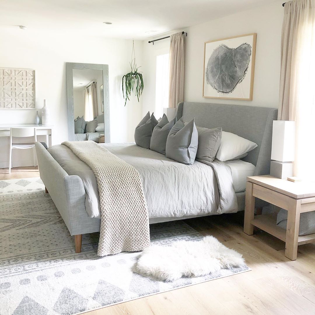 Neutral minimalist bedroom with mirror. Photo by Instagram user @thehouseonhillsidelane