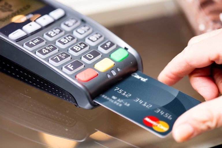 Credit card inserted into machine. Photo by Instagram user @nfinitech_solutions_corp