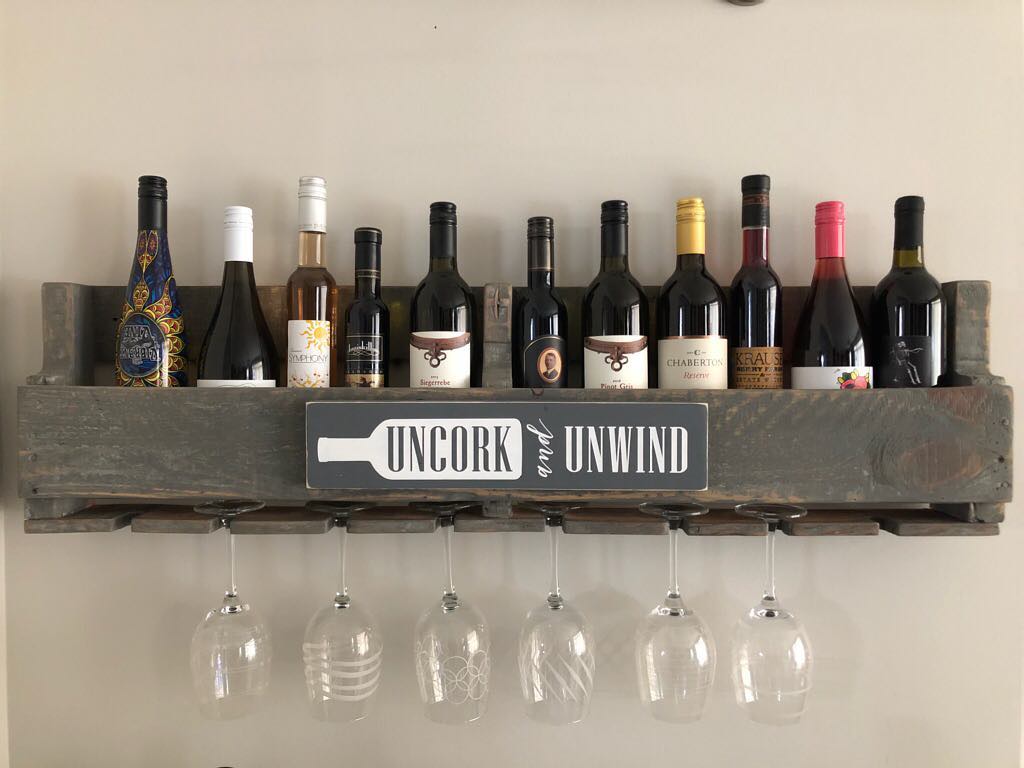 DIY Wine Rack with Glasses Hanging Underneath. Photo by Instagram user @homeworksetc.diy