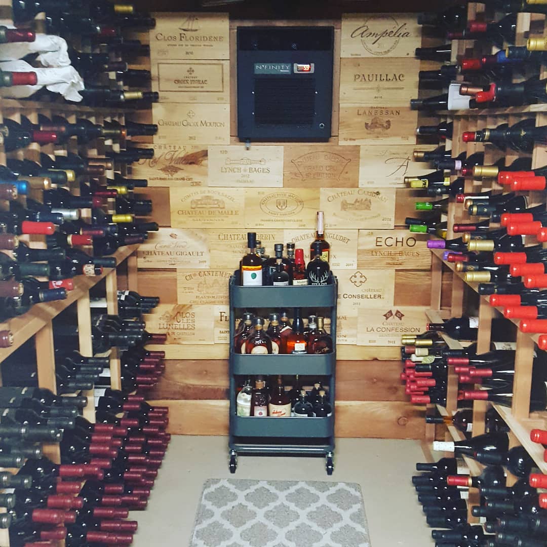 Wine Room with Walls Made out of Old Wine Boxes. Photo by Instagram user @philevans83