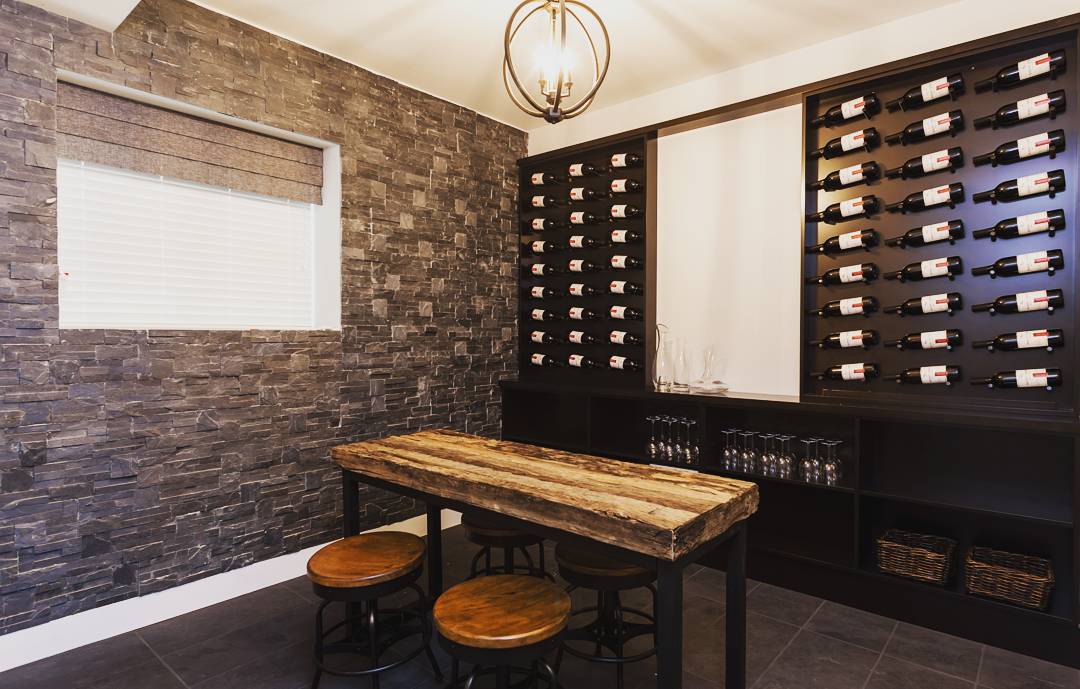 Wine Bottles Stored on the Wall of a Flex Space in Home. Photo by Instagram user @boldproperties