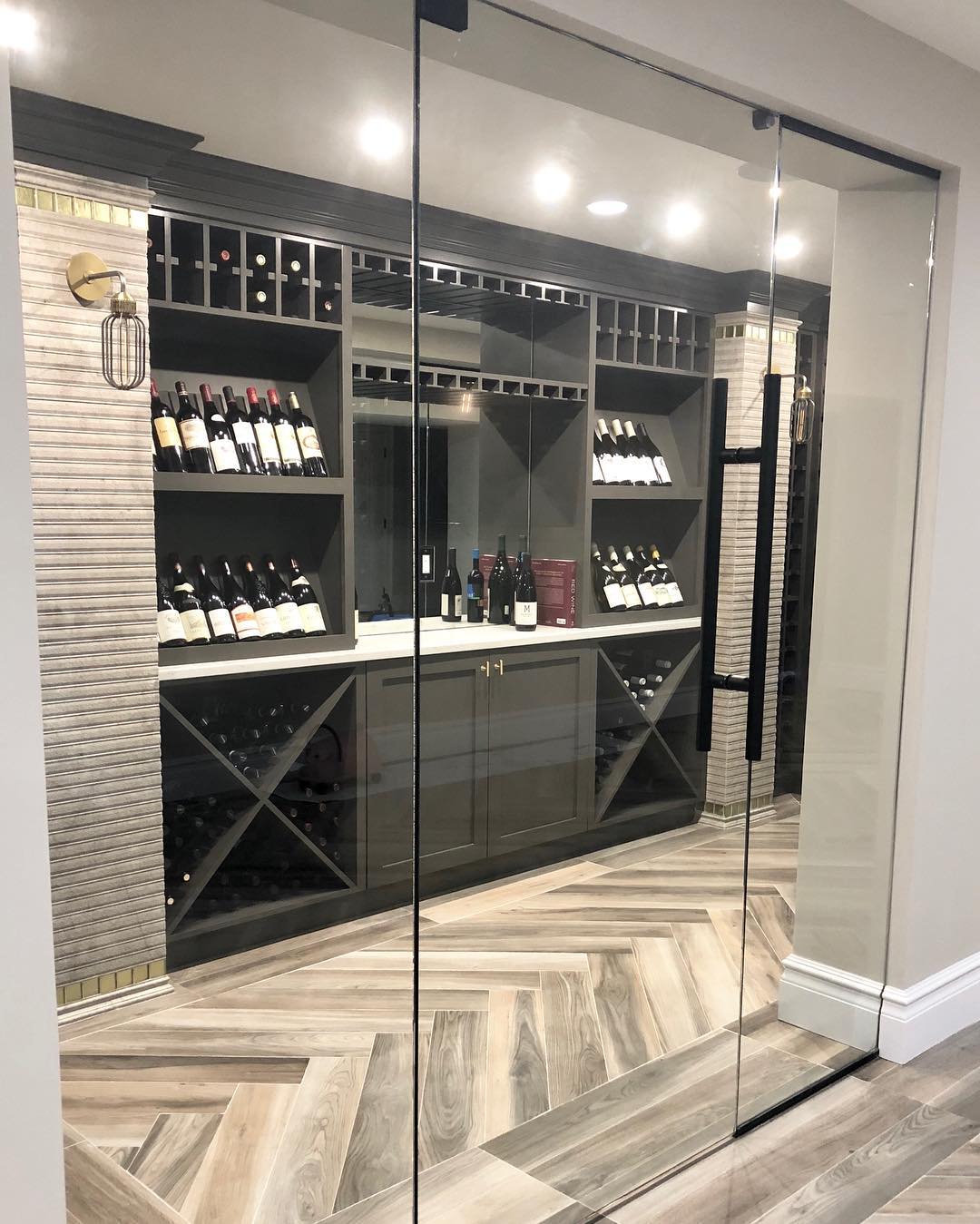 Wine Roomed with Paneled Flooring. Photo by Instagram user @jenniferpaccainteriors