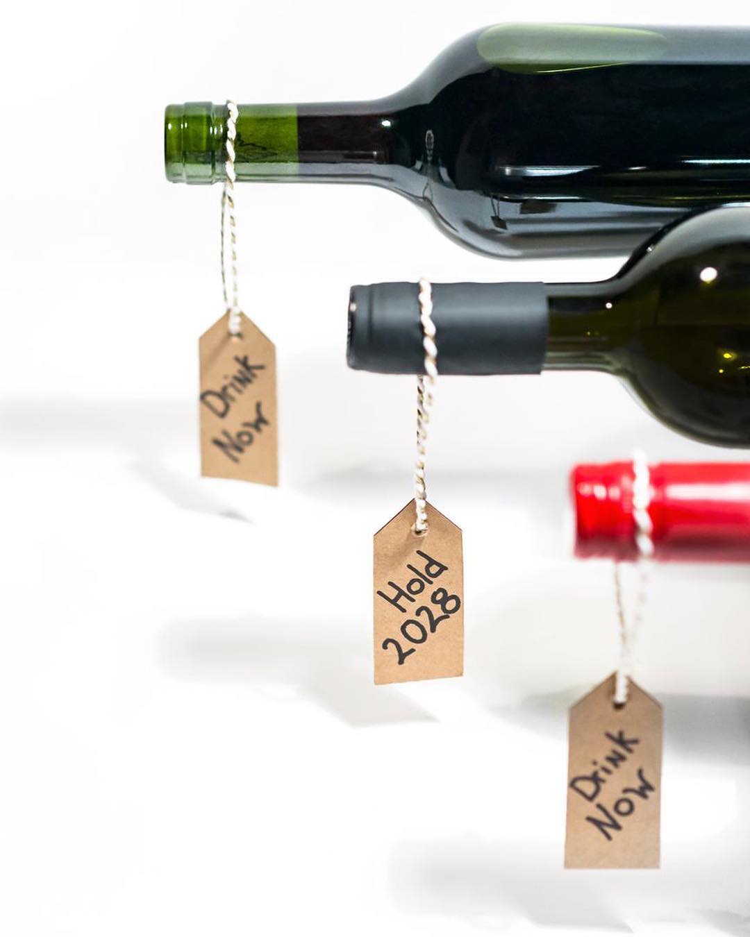 Wine Bottles with Tags to Indicate When to Drink. Photo by Instagram user @wineenthusiast