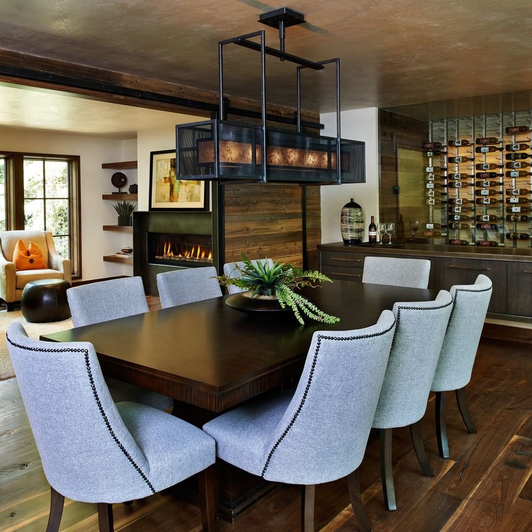 Wine Bottles Hanging on Back Wall of a Dining Room. Photo by Instagram user @vintageview_usa